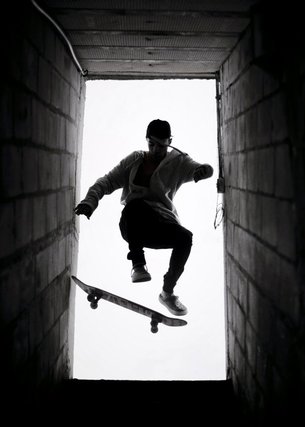 Skateboarder Silhouette in Doorframe