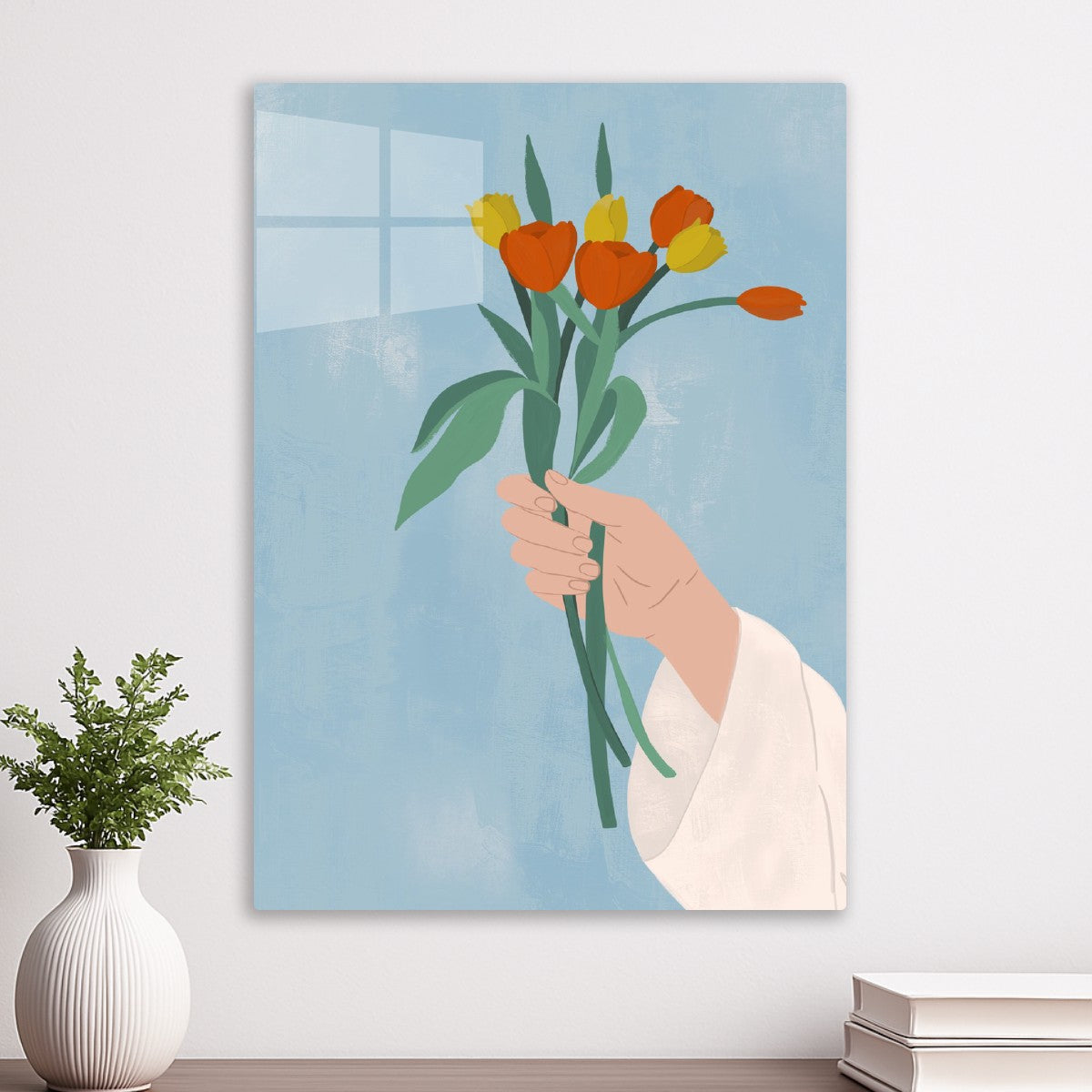 Hand holding tulips