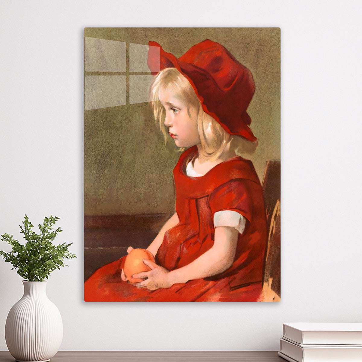 Girl with a red dress, holding an orange