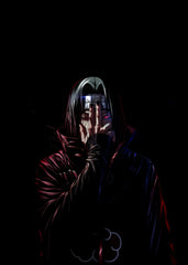  Itachi Uchiha fading into darkness, covering his face, glowing Sharingan eye, mysterious and dramatic.