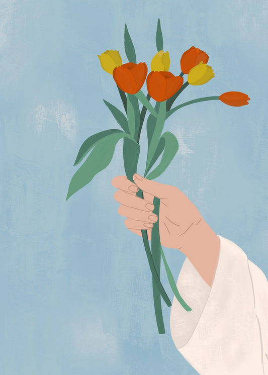 Hand holding tulips