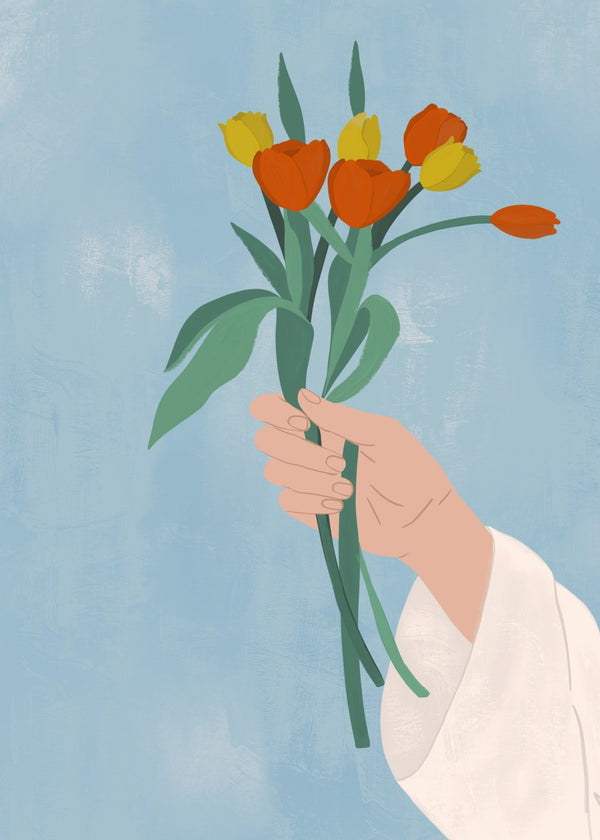Hand holding tulips